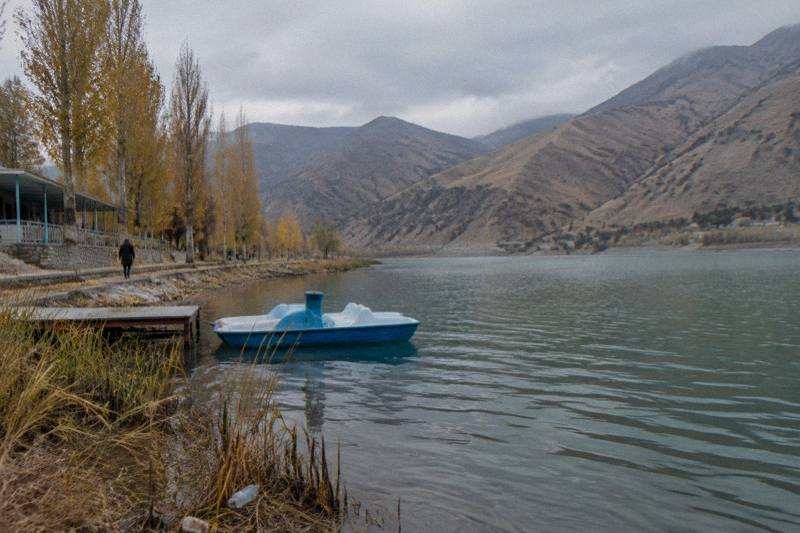 Charvak Reservoir with blue water surrounded by rugged mountains in the Tashkent region